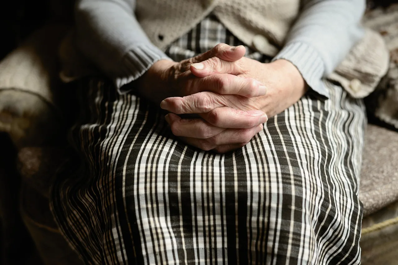 A caregiver assisting a senior with daily tasks at home.