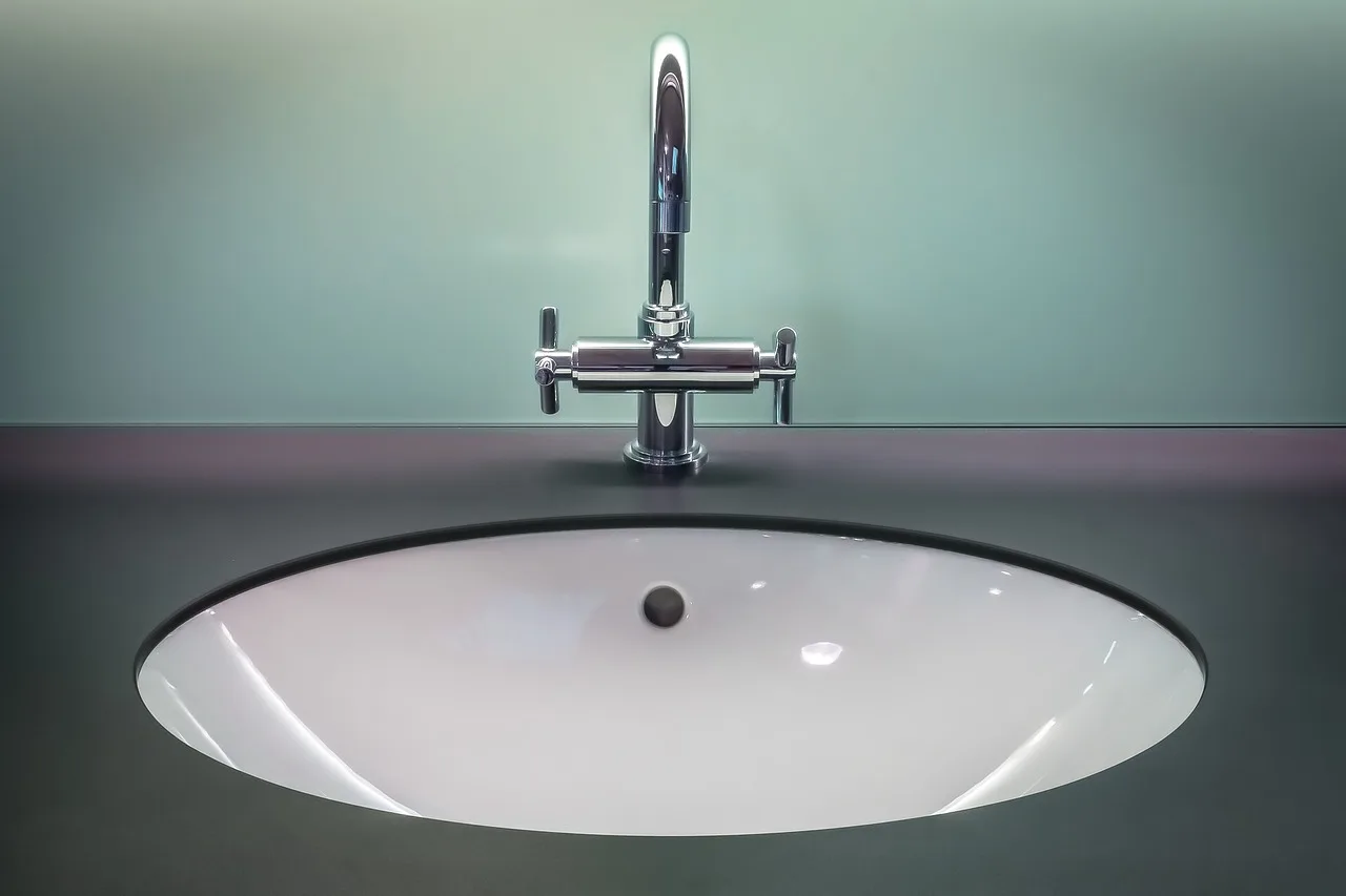 A bathroom equipped with grab bars, non-slip mats, and adequate lighting.