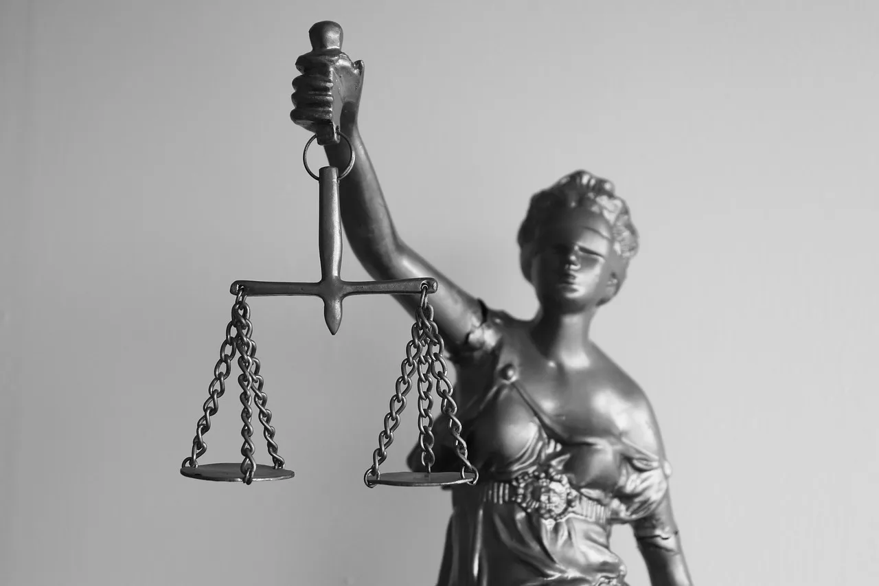Hands holding legal documents with a pen, illustrating the concept of power of attorney and healthcare proxies.